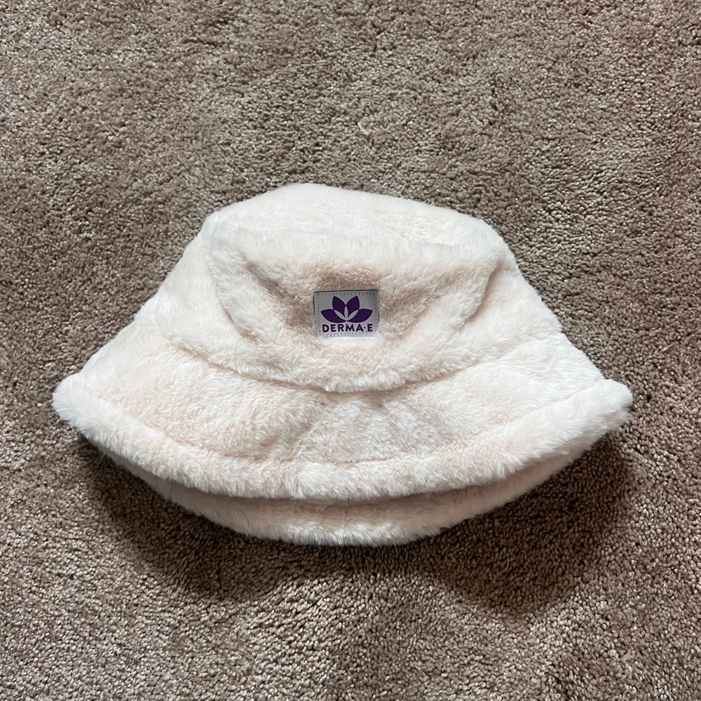 Soft White Furry Bucket Hat with Purple Logo - Trendy & Cozy Accessory
